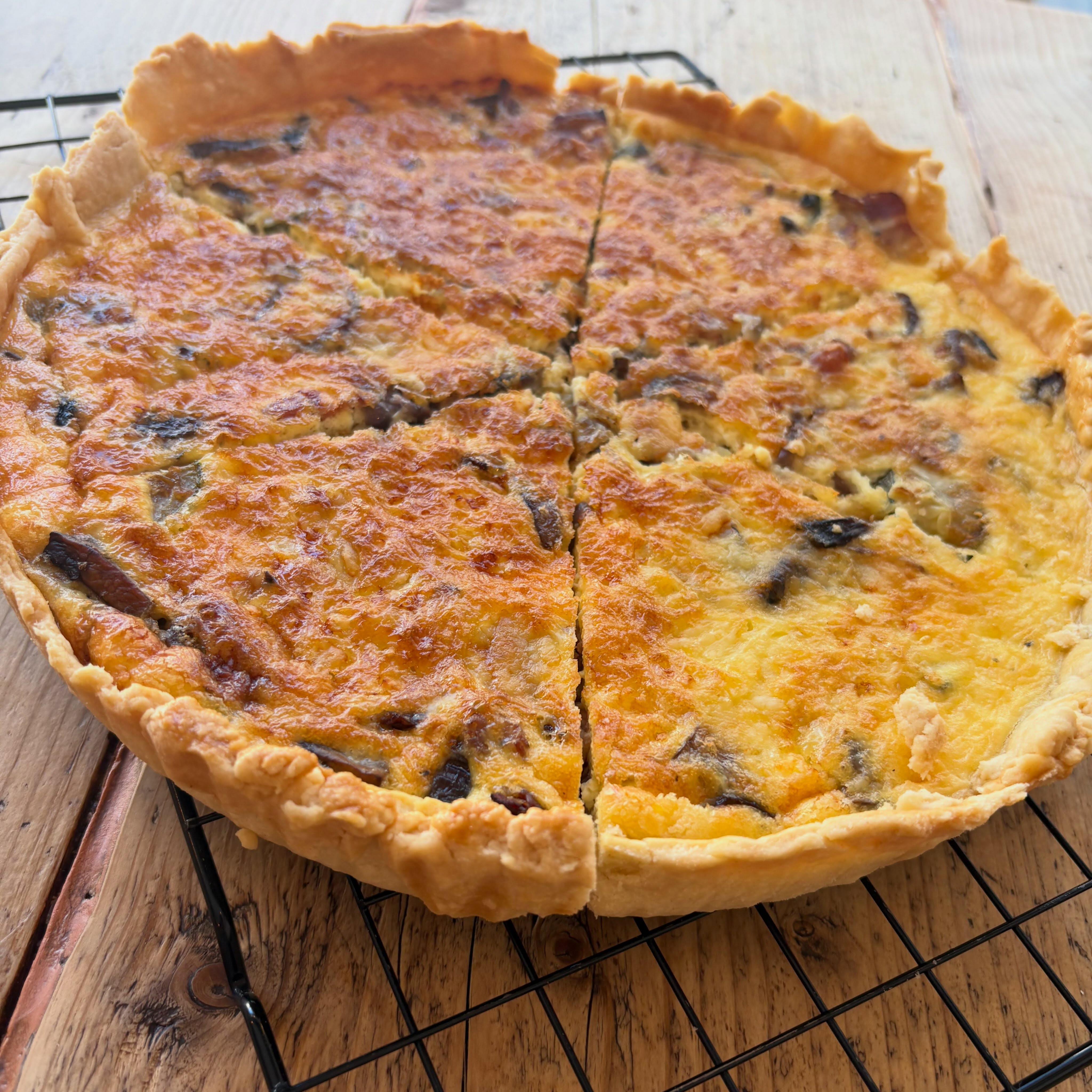 A savoury tart on a cooling rack, photographed by Lulamae’s
